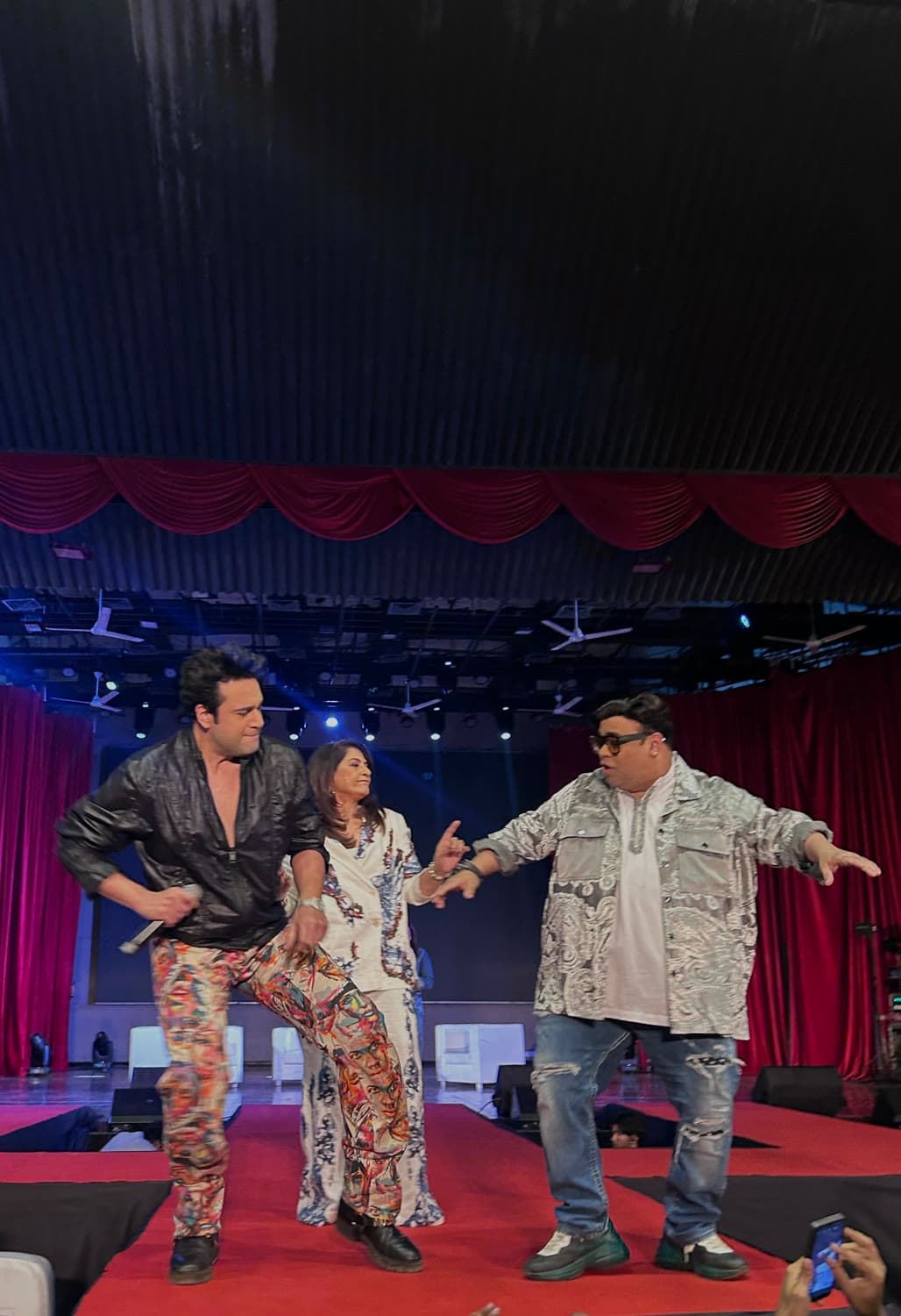 Performers dancing on stage during a live show