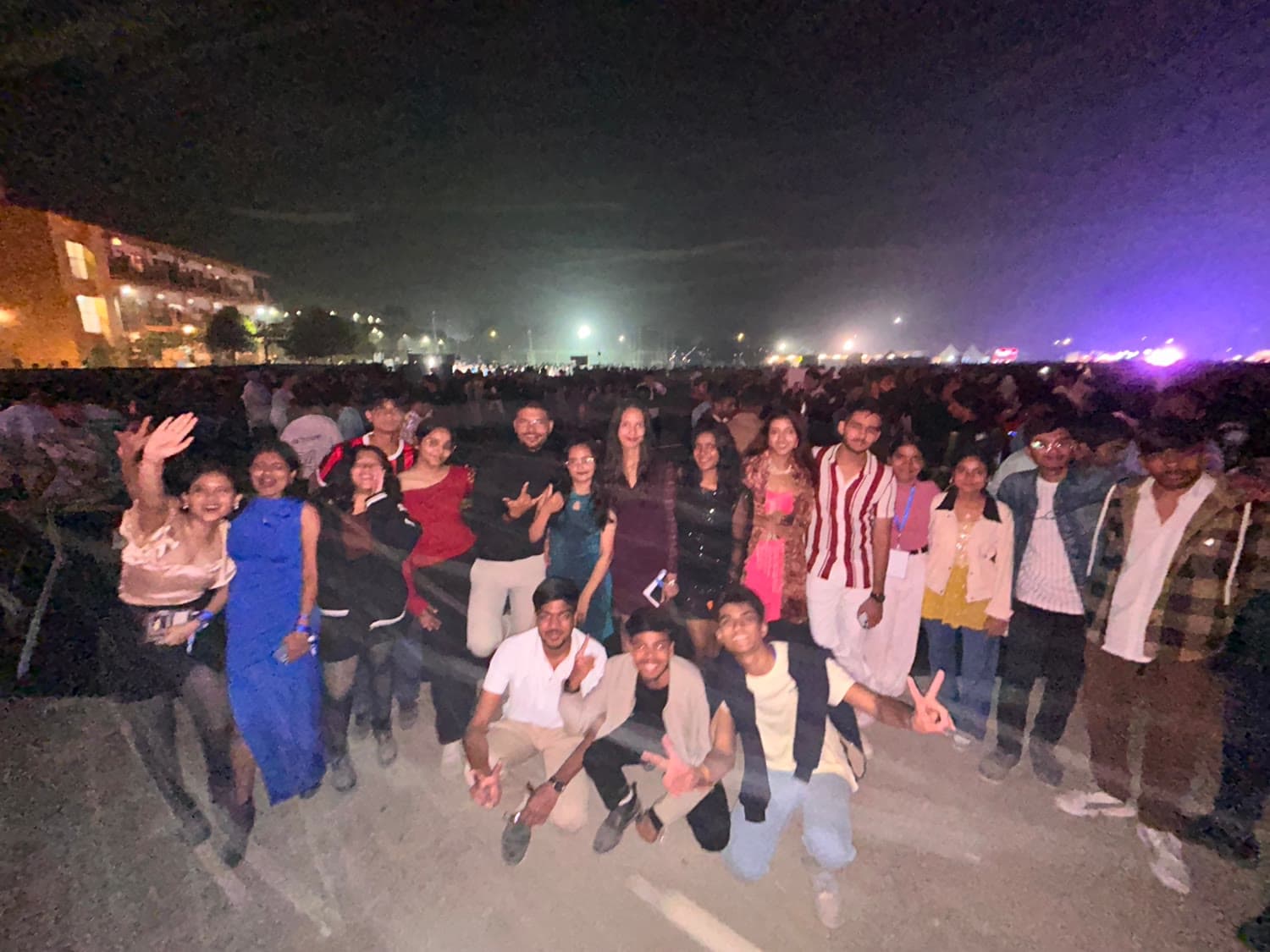 The group on the fest ground, the crowd stretching out behind