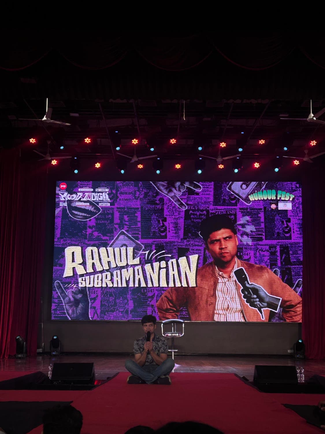 Stand-up at the fest, performer alone on a wide stage